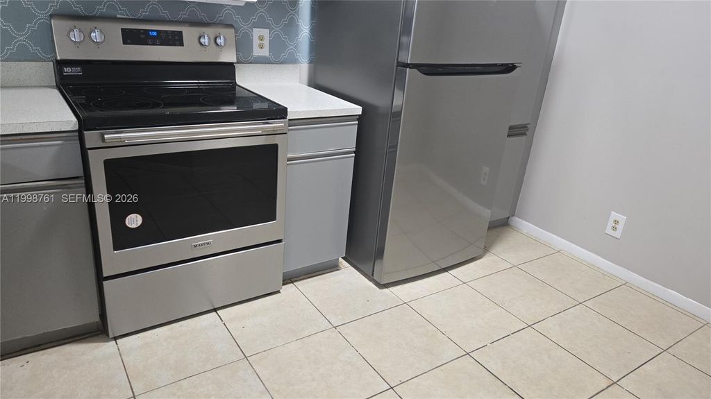 Photo of 8901 Wiles Rd #303, Coral Springs, FL 33067 (MLS # A11998761)