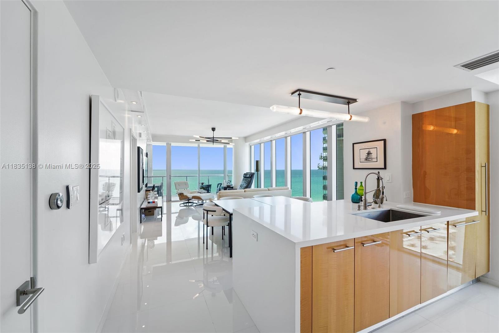 DIRECT OCEAN VIEW along with stunning bay, sunset, and city views from flow through corner unit at Carillon Miami Wellness Resort. Outdoor living space with large balcony spanning living room and master bedroom facing the ocean and an additional balcony off the second bedroom for enjoying sunsets. Some of the furniture and art in listing pictures will be exchanged with same modern classic style. Classes from morning until early evening offered 7 days a week. ALL included in rent. Indoor connector to 70,000 sq.ft hotel/fitness center. Thermal water therapies for relaxing and rejuvenating mind, body and soul. Three pools, bar, restaurant, 24hr sec, valet, concierge, salon, corner store, wellness staff. May consider committing now for winter season at $14,000/M. No pets. Min 6 mos lease.