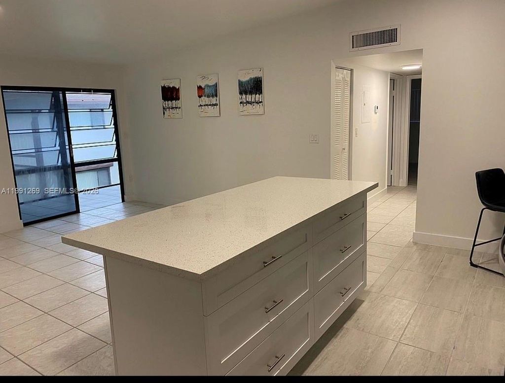 Photo of 9346 S Belfort Cir #215, Tamarac, FL 33321 (MLS # A11991269)