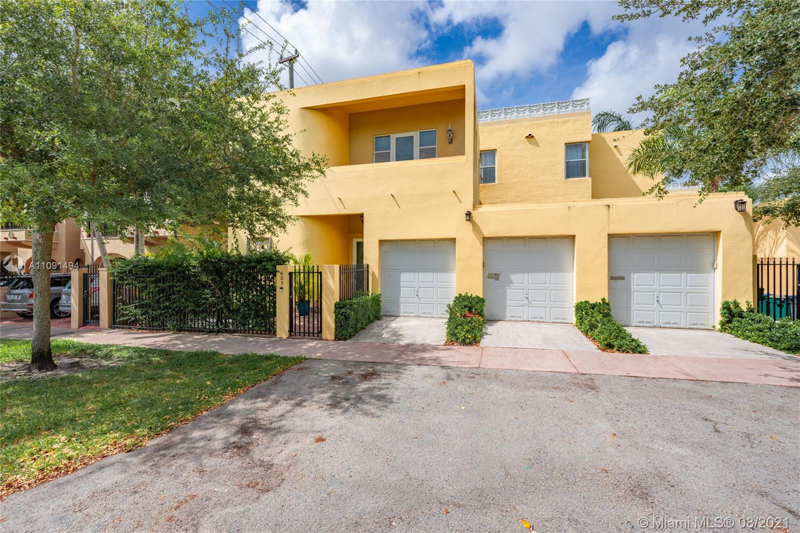 Welcome home to this one of a kind located in the heart of Coral Gables. Beautifully updated Art Deco townhome nestled on the quiet Segovia street. Walking distance to Merrick Park, The Miracle Mile, Venetian Pool, Granada Golf Course, and more so that you can enjoy neighborhood walks and entertainment. Featuring 2 bedrooms and 2.5 bathrooms, one space in a shared 2 car garage, and a bonus den not counted in the square footage on record (actual sqft is 1795) which can easily be used as an office, gym, or playroom! Entertain guests in the screened patio or the lush shared garden. Modern fixtures and impact windows and doors make this a truly turn-key home. Washer/dryer in-unit.