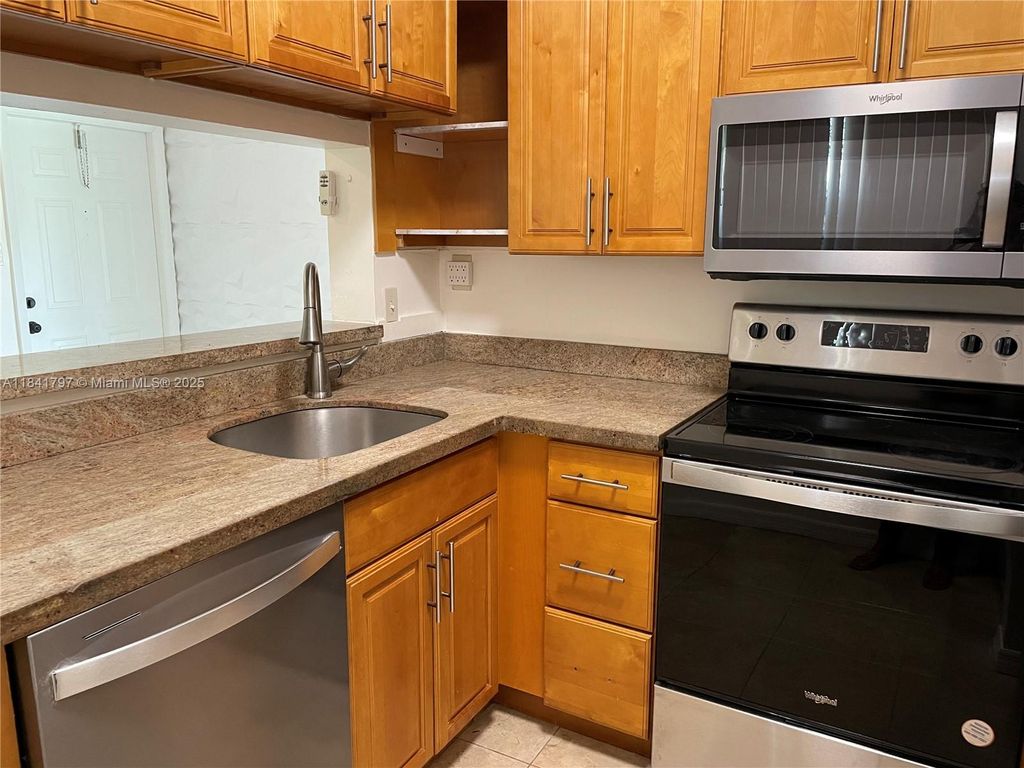 Photo of 661 Cypress Lake Blvd #J20, Deerfield Beach, FL 33064 (MLS # A11841797)