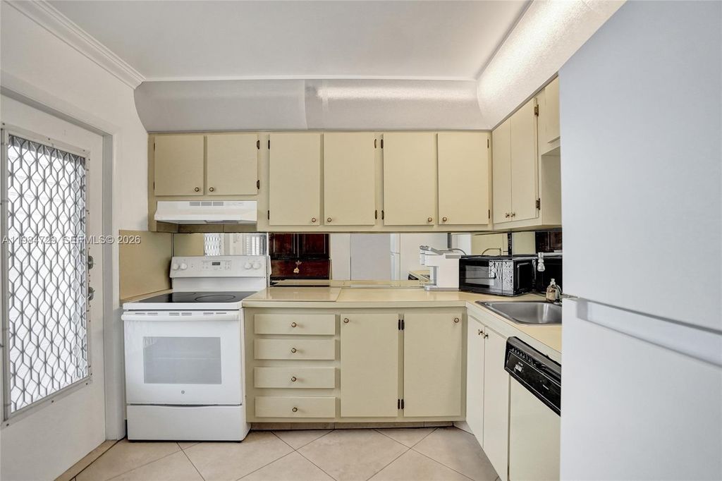 Photo of 3940 NW 42nd Ave #320, Lauderdale Lakes, FL 33319 (MLS # A11984729)