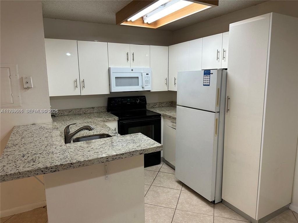 Photo of 951 Lyons Rd #6103, Coconut Creek, FL 33063 (MLS # A11939501)