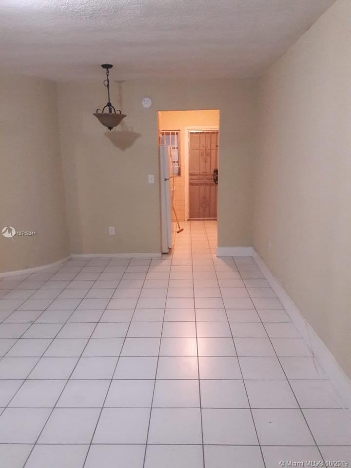 CORAL GARDENS CONDO BLDG - Residential Lease