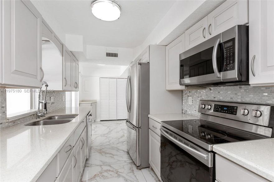 THREE BEDROOM,TWO BATH POOL HOME, WITH A GLASS ENCLOSED PORCH AND AN ADDITIONAL CONVERTABLE OFFICE/BEDROOM CONVERTED FROM THE GARAGE, AN UPDATED KITCHEN WITH GRANITE COUNTERTOPS, WOOD CABINETS AND UPGRADED APPLIANCES. THE HOUSE HAS BEEN COMPLETELY RETILED. THE HOME HAS A LARGE POOL IN THE FENCED BACKYARD