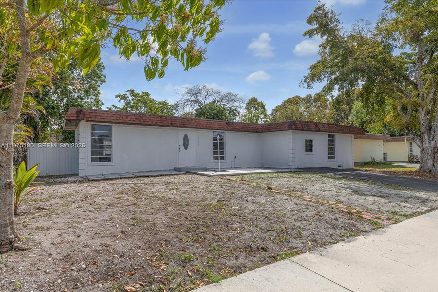 THREE BEDROOM,TWO BATH POOL HOME, WITH A GLASS ENCLOSED PORCH AND AN ADDITIONAL CONVERTABLE OFFICE/BEDROOM CONVERTED FROM THE GARAGE, AN UPDATED KITCHEN WITH GRANITE COUNTERTOPS, WOOD CABINETS AND UPGRADED APPLIANCES. THE HOUSE HAS BEEN COMPLETELY RETILED. THE HOME HAS A LARGE POOL IN THE FENCED BACKYARD