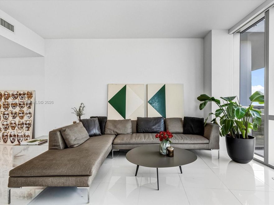 A rare opportunity to own one of the most desirable lines in the building, offered in pristine, new condition on the highest floor prior to the penthouse. This premier corner residence features unobstructed views and exceptional natural light throughout.

A private den / office allows the home to function as a true 4-bedroom, 4-bathroom residence, ideal for both full-time living and refined entertaining. Floor-to-ceiling glass walls frame breathtaking city and skyline views from every angle, creating a bright and expansive living experience.

The open-concept kitchen is appointed with top-of-the-line appliances, including a Sub-Zero refrigerator, Wolf cooktop and oven, and Bosch dishwasher, complemented by sleek modern cabinetry and premium finishes throughout.

Paramount Miami Worldcenter is a full-service luxury building offering world-class amenities, ideally located in the heart of Miami’s new area Park west