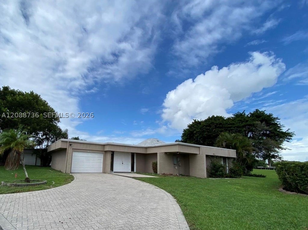 Photo of 6105 Royal Poinciana Ln, Tamarac, FL 33319 (MLS # A12088736)
