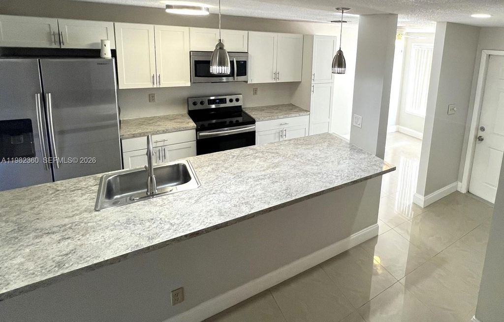 Photo of 8249 NW 8th Pl #4, Plantation, FL 33324 (MLS # A11982360)