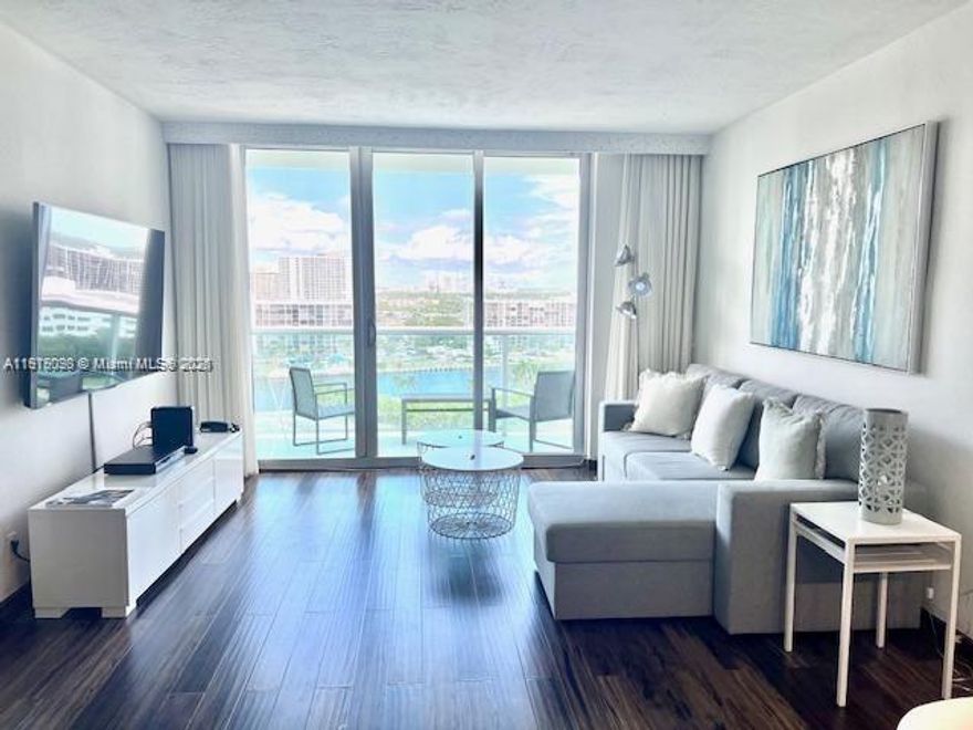 The Tides complex on the beach offering covered parking, convenience store and beach service. This two-bedroom/ two-bathroom , unit is completely renovated with laminated floors, wood doors, updated bathrooms and kitchen including premium appliances and WASHER AND DRYER inside the unit. Balcony with west view of intracoastal and city skyline. Short time rentals allowed.