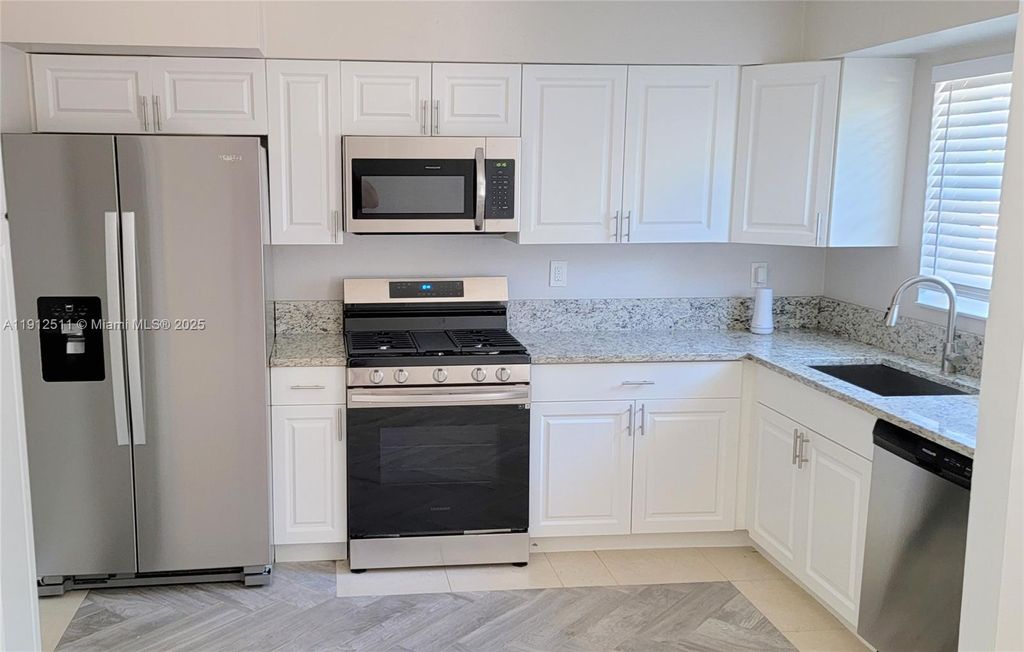 Photo of 906 Greenbriar Dr #906, Lake Park, FL 33403 (MLS # A11912511)