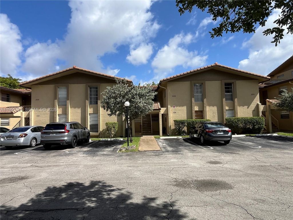 Photo of 11101 Royal Palm Blvd #203, Coral Springs, FL 33065 (MLS # A11995764)