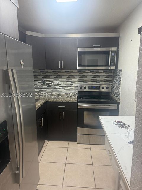 Photo of 6095 W 18th Ave #S106, Hialeah, FL 33012 (MLS # A12058302)