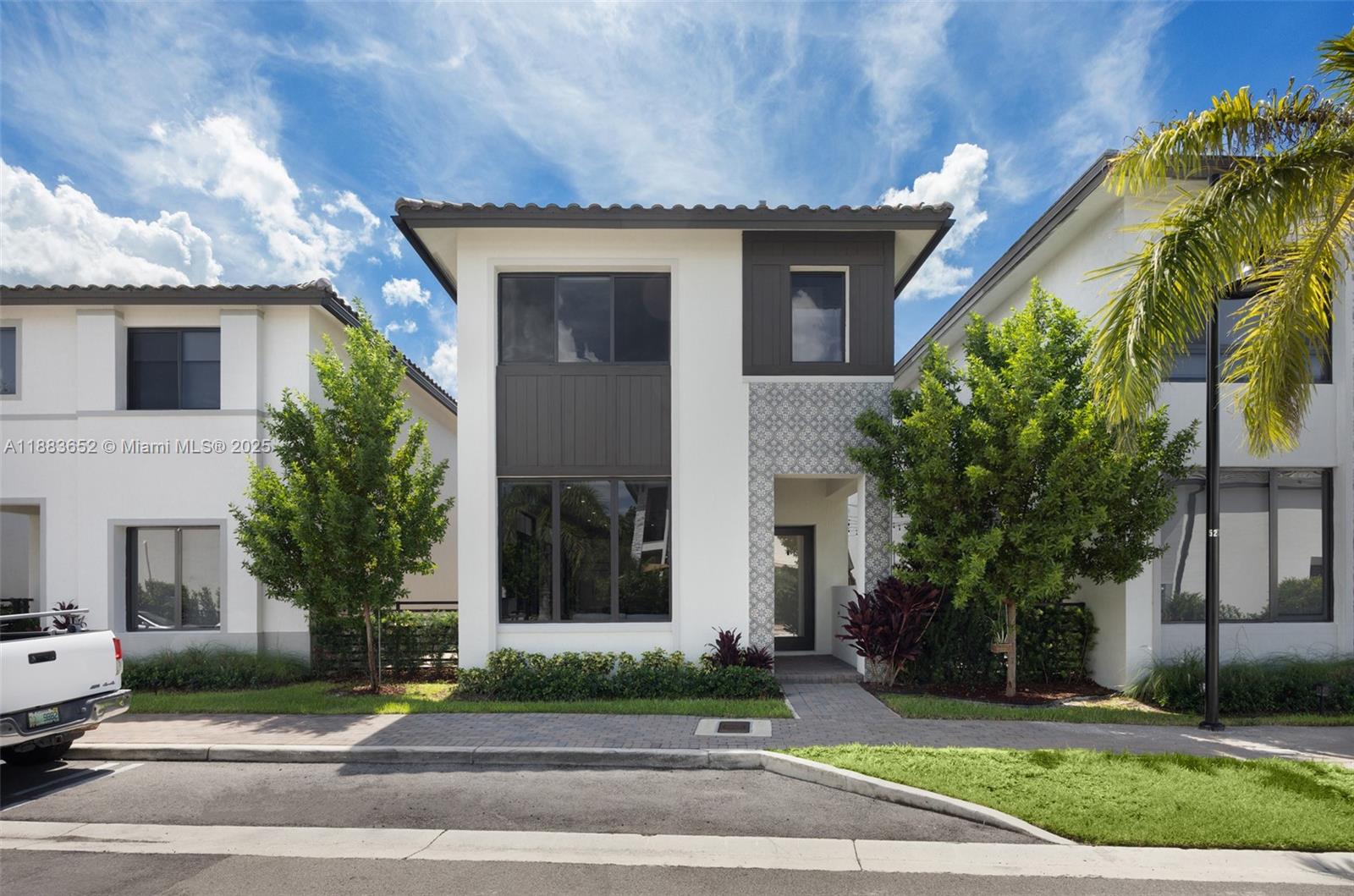 Move-in ready and fully upgraded, this 2023 two-story home in Canarias offers refined living in the heart of Downtown Doral. Herringbone wood floors, a chef’s kitchen with Wolf and Sub-Zero appliances, and a custom loft enhance everyday comfort. Enjoy impact windows, a spacious 2-car garage, plus an extra assigned space. Walk to parks, top schools, cafés, and Publix. Residents have access to a state-of-the-art clubhouse, resort-style pool, two-story gym, indoor track, and more—set in Doral’s most walkable neighborhood.