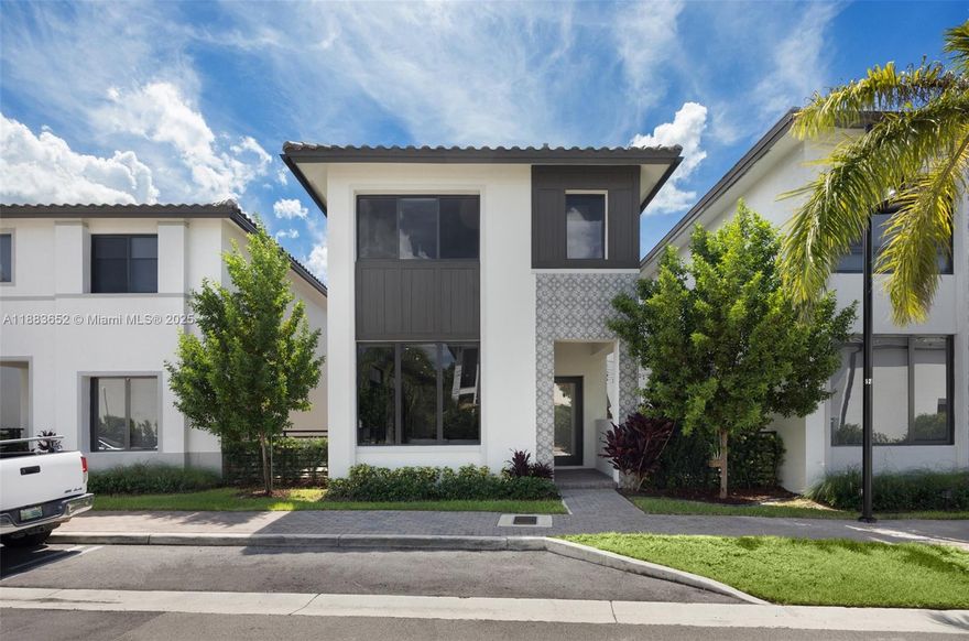 Move-in ready and fully upgraded, this 2023 two-story home in Canarias offers refined living in the heart of Downtown Doral. Herringbone wood floors, a chef’s kitchen with Wolf and Sub-Zero appliances, and a custom loft enhance everyday comfort. Enjoy impact windows, a spacious 2-car garage, plus an extra assigned space. Walk to parks, top schools, cafés, and Publix. Residents have access to a state-of-the-art clubhouse, resort-style pool, two-story gym, indoor track, and more—set in Doral’s most walkable neighborhood.