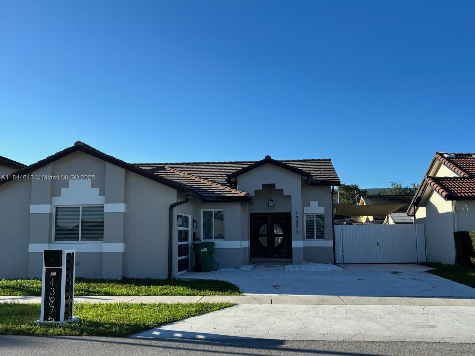 Beautifully maintained 3BD/2BA single-family home in a quiet and family-friendly neighborhood. This spacious home features an updated kitchen with stainless steel appliances, tile flooring throughout, indoor laundry, and a private backyard with a covered terrace and white Dura Fence — perfect for outdoor entertaining. Driveway parking included. Move-in ready! Conveniently located near schools, shopping centers, and major highways. Easy to show!