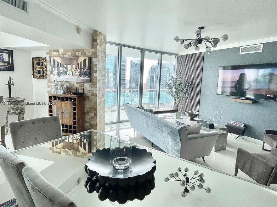 Best unit in the building, many upgrades and nicely decorated. Third bedroom is open to integrate the living room for a bigger layout. City and river view like no other building in the area. (Wall art, decorations and personal items not included). Wont last!