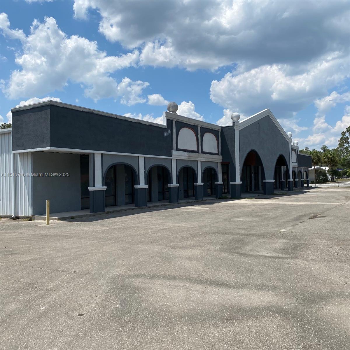Commercial property Over 20,000+ sq ft Bldg. 2 showrooms, 1 measuring 9,500 sq ft & other spanning 6,500 sq ft. A 3,500 sq ft warehouse offers storage.2 office spaces, 2 restrooms plus bonus storage room, 30-space parking lot, large pylon sign. Equipped with a 435 sq ft loading dock, roll-up door. 1,300 sq ft covered breezeway with 160 feet of glass storefront enhances the aesthetic appeal & allows for a bright and inviting atmosphere. The property features 3-phase electric. The roof recently refurbished 2021. A new 20’X100’ firewall,2 double steel doors divides the two showrooms Situated on 11.79 acres, 535 ft frontage & depth of 900ft.The building is situated on 2 cleared acres with approximately 10 acres of pine & oak trees.