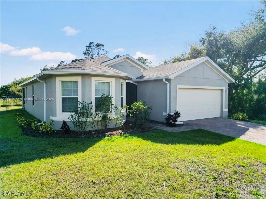 Welcome to this home 3 bed, 2 Bath home, thoughtfully designed to maximize living space and comfort. The spacious kitchen features ample cabinet and counter space and is seamlessly connected to the large great room, dining room, and covered lanai. A delightful breakfast nook surrounded by bay windows floods. The private primary bedroom is located at the back of the home and offers a peaceful retreat with an ensuite bathroom, complete with double vanity and a generously sized walk-in closet. Two additional bedrooms share a second bathroom, providing ample space for family or guests.Super easy access to Sunshine Blvd S and SR82. Close to world-class & casual dining, ever-expanding shopping areas, international airport, year-around sunshine, and miles of sandy beaches.