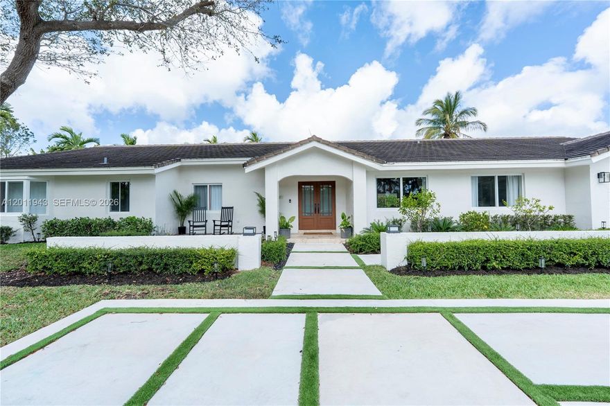 This exceptional home is competitively priced as the sellers prepare for an out-of-state move for an exciting career opportunity. Originally renovated as their forever home, every detail was thoughtfully designed for both beauty and functionality.
The heart of the home is a stunning custom kitchen featuring a built-in refrigerator, double ovens, an oversized sink, and a vented stove, along with two expansive islands finished in Taj Mahal quartzite—perfect for daily living and entertaining. An extra-long window fills the space with natural light and offers serene pool views. The open layout is highlighted by soaring vaulted ceilings, smart lighting throughout, and a custom-built entertainment center that extends seamlessly to the ceiling, creating a dramatic focal point in the main living area.

The oversized primary suite includes a walk-in closet and a spa-like bath with an oversized shower, dual vanities, and soaking tub. Two additional bedrooms each feature en suite baths. In total, the home offers four marble bathrooms with Delta and Moen fixtures, impact windows and doors, and continuous flooring throughout.
Outside, enjoy a 42-ft saline, app-controlled pool on an oversized lot with room for a future outdoor kitchen, plus two mature mango trees. Situated on a quiet cul-de-sac in a family-friendly neighborhood with a large front yard and new driveway. Conveniently located minutes from major highways, walking distance to Leewood K-8, and zoned for A-rated Killian High.