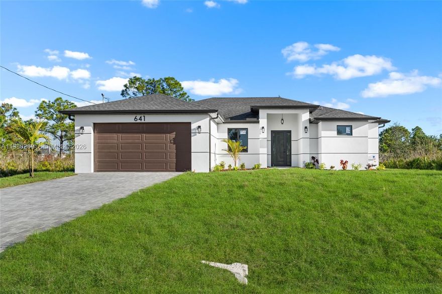 New construction home in Lehigh Acres with a functional split floor plan and modern finishes throughout. Open living area with good natural light and a layout that makes sense for everyday use. Features include a custom kitchen, built-out closets, and attention to detail throughout the home. All appliances are included, including washer and dryer. The design allows for a private side of the home that can support separate living space, with potential for a kitchenette and its own washer/dryer setup. Located on a quiet street with ongoing new construction nearby. No HOA and easy access to main roads, shopping, and schools. Move-in ready with a layout that stands out in this price range.