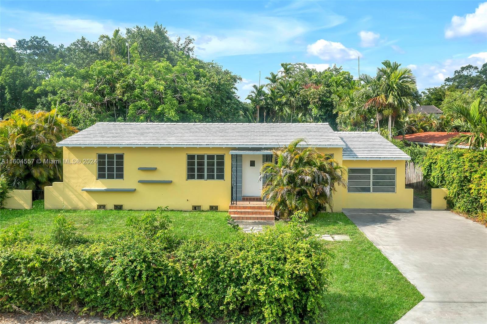 Charming 3-bedroom 1-bathroom house in the heart of Biscayne Park. The large backyard is surrounded by fruit trees, tropical trees, and features a second structure in the back. This gorgeous and secluded lot offers a wide range of development possibilities: addition, pool, guest house... Lovingly maintained by its owner, the house features an additional bonus room and connection for a second bathroom. With its large windows, it is bathed in sunlight. The hardwood floors bring old-time charm. New AC and a recent roof have been installed. Don’t miss out on making this house your own - schedule a viewing today and unlock its hidden potential.