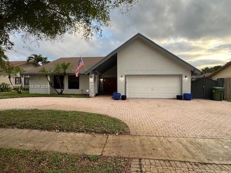 Rare opportuinity to own in Pembroke Pines with NO HOA!  Discover the Woodbridge community, nestled in the heart of Pembroke Lakes area.  This home features an open-concept living layout, a spacious primary bedroom, and three additional guest bedrooms.  Enjoy exceptional outdoor living with a private pool and outdoor shower, perfect for entertaining.  Updates include impact windows and an impact garage door.  Centrally located near shopping , dining and top-rated schools.  Schedule your showing today!