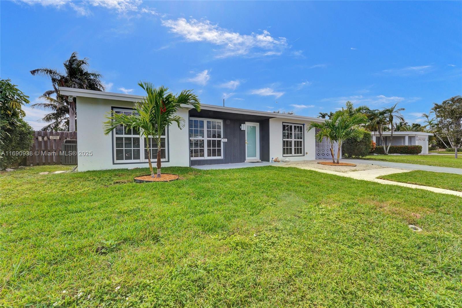 Nestled in the heart of East Deerfield Beach, this immaculate & contemporary turnkey 2-bed, 2-bath home is a true gem. With a new roof and all impact-rated windows/doors, this property is designed for both style and peace of mind. The open floor plan is ideal for entertaining, flowing seamlessly from the spacious living areas to the stunning kitchen, which features elegant Carrara quartz countertops and all-new stainless-steel appliances. The formal dining room is a standout, boasting high ceilings and large windows that flood the space with natural light. Outside, the meticulously maintained landscaping and charming curb appeal are enhanced by beautiful Christmas palms. Step into your private backyard oasis, complete with a cozy fire pit area. Close to the beach, eateries & entertainment!