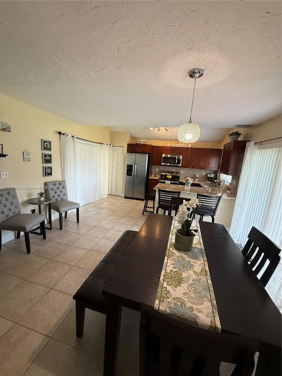 Beautiful Townhome 2/2 located in Plantation area between I95 and the Sawgrass Expressway. Property offer a private garden surrounded with plants and trees and a cozy patio that you can enjoy with your family and friends. When you enter the property you'll find a very spacious living room connected with an open concept kitchen and huge dining room. The bedrooms upstairs are amplius with a huge closets. The HOA is responsible for repair/replacement ,common area landscaping and external insurance. Community offer a beautiful pool that you can enjoy with your family. A must See!! Roof 2019 Impact windows and doors.AC 2023 . S.S Appliances.