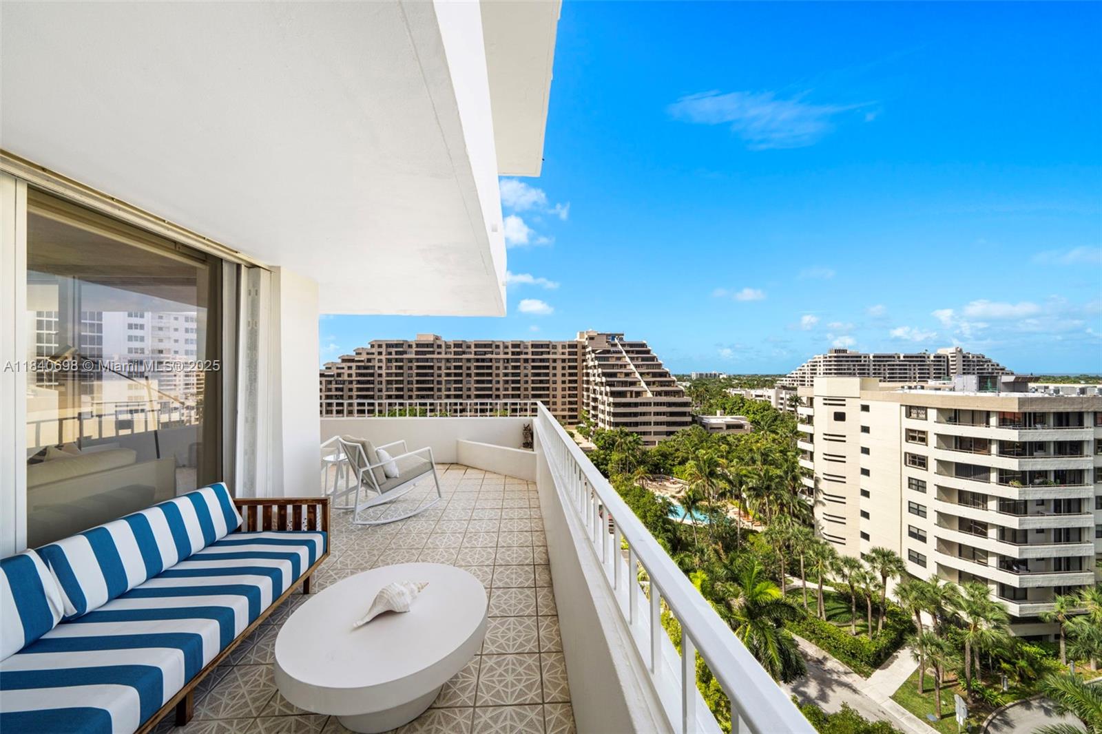 BEAUTIFULLY REMODELED AND FULLY FURNISHED 2-BEDROOM, 2- BATH CORNER UNIT AT COMMODORE CLUB SOUTH! BRIGHT AND MODERN WITH VINYL WOOD FLOORS. OPEN LIVING AREA LEADING TO A WRAPAROUND BALCONY WITH STUNNING OCEAN AND BAY VIEWS, WASHER AND DRYER INSIDE THE UNIT, KITCHEN WITH STAINLESS STEEL APPLIANCES AND OPEN SNACK BAR/COUNTERTOP TO AN OPEN DINING AREA. MASTER BEDROOM WITH A LARGE WALK-IN CLOSET. UNIT IS COMPLETE PROTECTED WITH HURRICANE ACCORDION SHUTTERS, AND IMPACT WINDOWS IN THE LIVING AND DINING AREA. AMENITIES INCLUDE SECURE BUILDING WITH A GATE GUARD, TENNIS COURT, POOL, GYM, SECURITY 24/7. WALKING DISTANCE TO THE BEACH. UNIT COMES WITH A SMALL STORAGE ON THE SAME FLOOR. WALKING AND BIKING TO ALL THE LIFESTYLE OF KEY BISCAYNE! ALL FURNITURE ARE INCLUDED IN THE SALE!