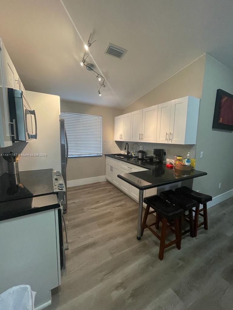 Remodeled Townhouse – Move-In Ready!
Discover this unique and exclusive 2-bedroom, 2-bathroom townhouse, thoughtfully remodeled with modern finishes throughout. Featuring Quartz countertops, this home is perfect for those seeking comfort and convenience.
Enjoy the perks of 2 assigned parking spaces, stainless steal appliances, in-unit washer and dryer, and accordion shutters for added protection. The community offers great amenities including a swimming pool and tennis court – perfect for relaxation and recreation.
Centrally located with easy access to major highways, minutes from airport, shopping, dining, and more. Easy to show – schedule your tour today!
