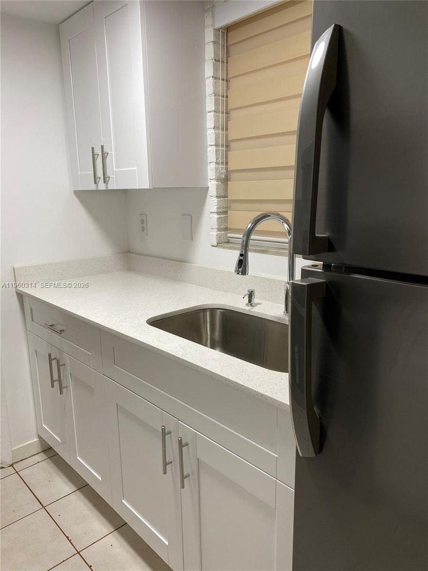 Very spacious and filled with natural light, this beautifully maintained 1-bedroom, 1-bath residence is perfectly located near the iconic Museum of Modern Art (MoMA) and just steps from 125th Street and NE 6th Avenue in Miami.

Featuring sleek tile flooring throughout, this home offers a clean, modern feel. The recently remodeled kitchen boasts stylish finishes and updated cabinetry, while the renovated bathroom adds a fresh, contemporary touch.

Currently rented through October 2027, this property presents an excellent investment opportunity with stable income in place.

Enjoy community amenities including a sparkling pool, convenient on-site laundry facilities, and assigned parking right at your doorstep. Please note: no pets allowed.

Bright, spacious, and ideally situated — a smart investment in a prime location.