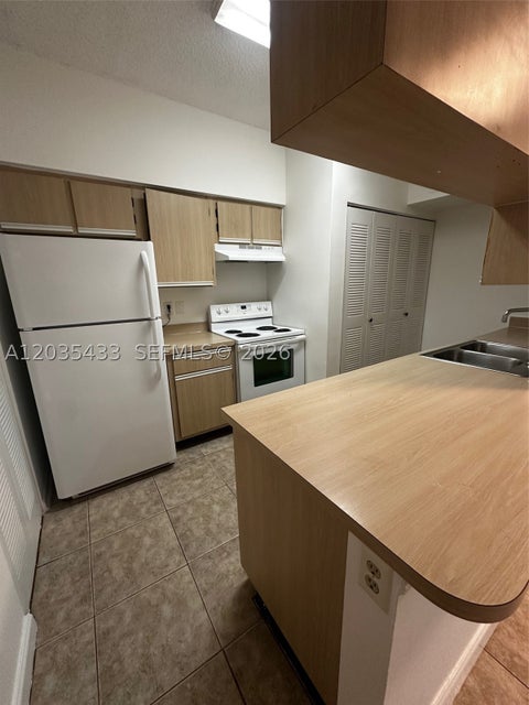 Photo of 18356 NW 68th Ave #K, Hialeah, FL 33015 (MLS # A12035433)