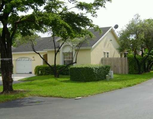 Charming Corner Lot Home in Doral Lakes! Located in a highly sought-after community with access to top-rated schools & excellent amenities, this spacious and light-filled residence offers the perfect blend of comfort and convenience. Competitively priced! Perfect for buyers seeking value & willing to modernize - reflected in asking price. Featuring terracotta flooring thru-out & newly installed roof (2022) w/ soaring high ceilings. This home feels and IS larger than the sqft reflected on the tax roll. Enjoy a bright open-concept layout with abundant natural light and seamless access to the backyard. Two dedicated parking spaces are conveniently located at the front, with additional guest parking nearby. Don’t miss the opportunity to live in one of Doral’s most desirable neighborhoods!