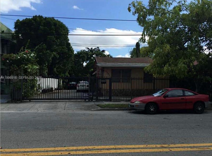 Excellent location! This income producing property is highly sought-after and fresh on the market, with lots of potential, area is only going up in value. 2/1 single house in the front and two story property in the back that consist of two apartments, dow nstairs is a 1/1 owner occupied (this unit has a 2nd bedroom and bath addition) and upstairs is a 1/1 tenant occupied. Large Lot with muli family zoning. Drive way has space for 4 cars. Property in the back of the lot has gate entry