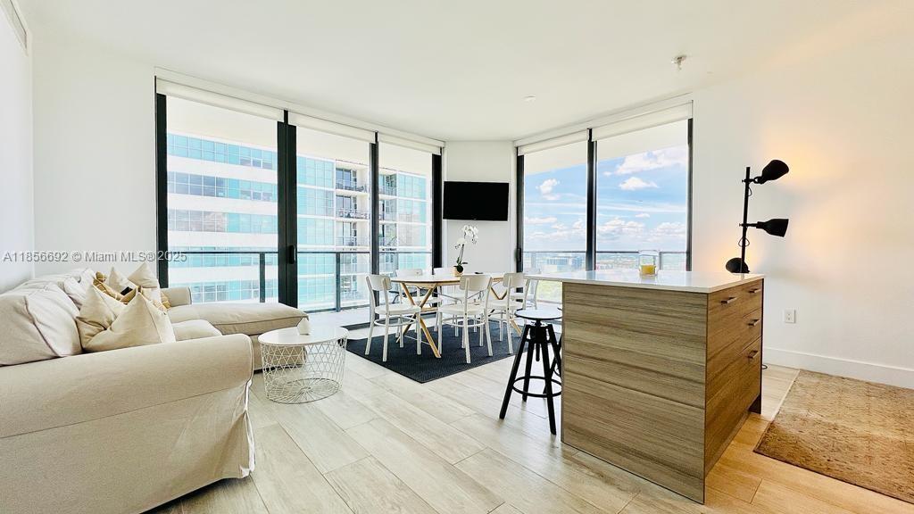 Discover luxury living style in Miami at HYDE MIDTOWN with this exceptional 2-bedroom, 2-bathroom corner condo. Fully furnished, it features a convenient in-unit washer and dryer and a modern open kitchen with white quartz countertops, stainless steel appliances, and sleek cabinets. Enjoy breathtaking city views from every angle. The master bedroom boasts a custom walk-in closet and a spacious, beautifully finished bathroom. Throughout the condo, crisp white Cristal tiles enhance the ambiance, complemented by fresh white paint. Rent includes water, basic cable TV, Internet, and valet parking for one car. Experience first class amenities including tennis courts, pool and terrace, bar and grill lounge, exercise room, game room, business center, full-service spa, dedicated kids lounge, etc.