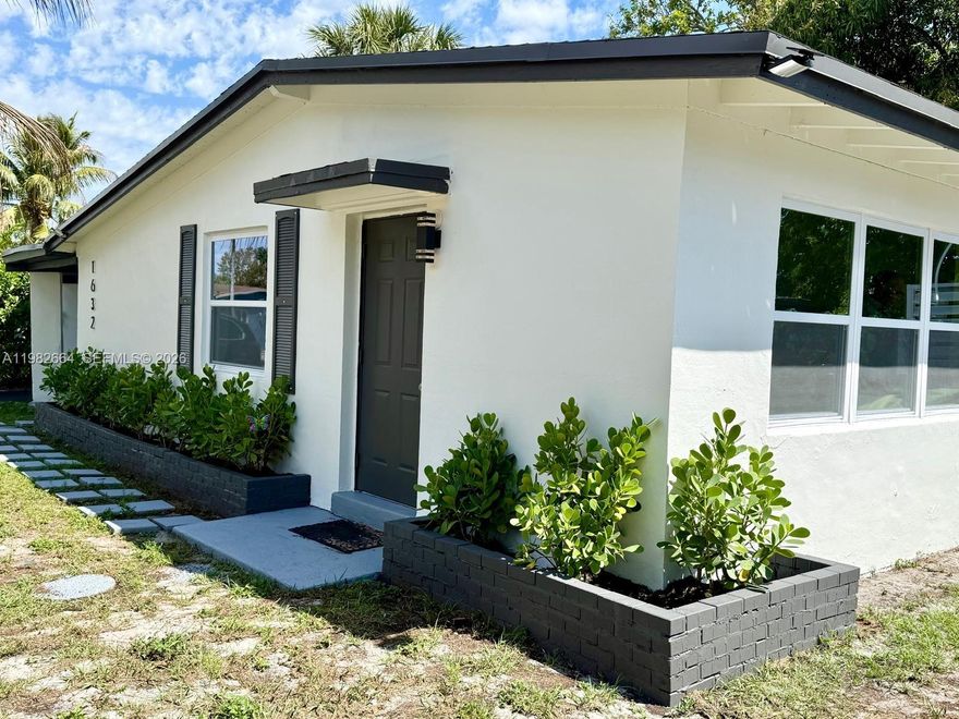 This move-in-ready single family home offers the rare opportunity to enjoy a newly renovated, spacious home in an established, peaceful community.  Beautifully remodeled (total area 1,363 sqft) 3-bedrooms, 1-bathroom single-family home located in the heart of Fort Lauderdale. NEW ROOF 2025 and impact windows. White Kitchen cabinets with modern QUARTZ countertop. NEWER CENTRAL AC.Large laundry room equipped with a washer and dryer with space for storage. The backyard is fully enclosed by a private fence, offering a secure and expansive space for pets, play, or weekend gatherings. Additional features include a large carport and a prime location just minutes from the vibrant entertainment of downtown Fort Lauderdale and its world-famous beaches.
