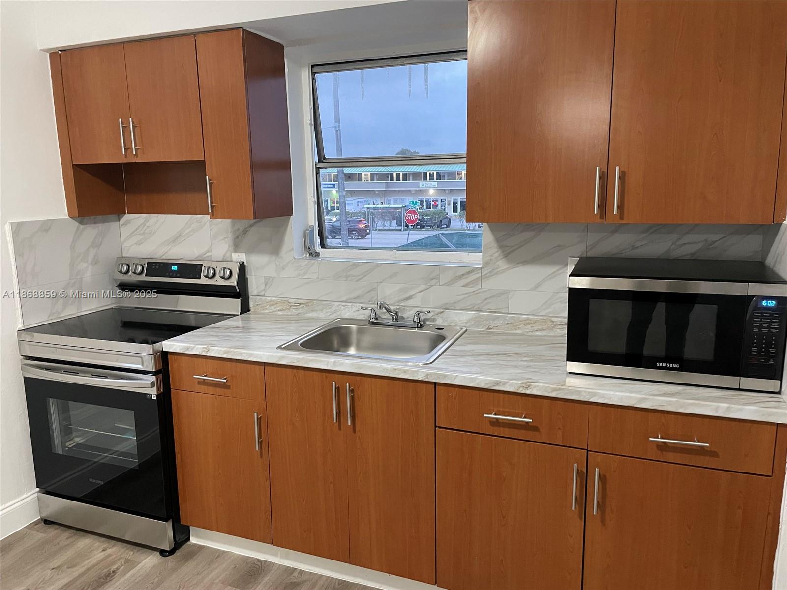 Spacious & Renovated Unit in the 2nd floor 2 Bed/1 Bath Plenty space for 2 cars Van or Trucks. Stainless Steel Appliances. Tyle Floors, 15 Minutes from Downtown, Close to 836 Access & I-95. Rapid Approval See Broker Remarks for Showing instruction.