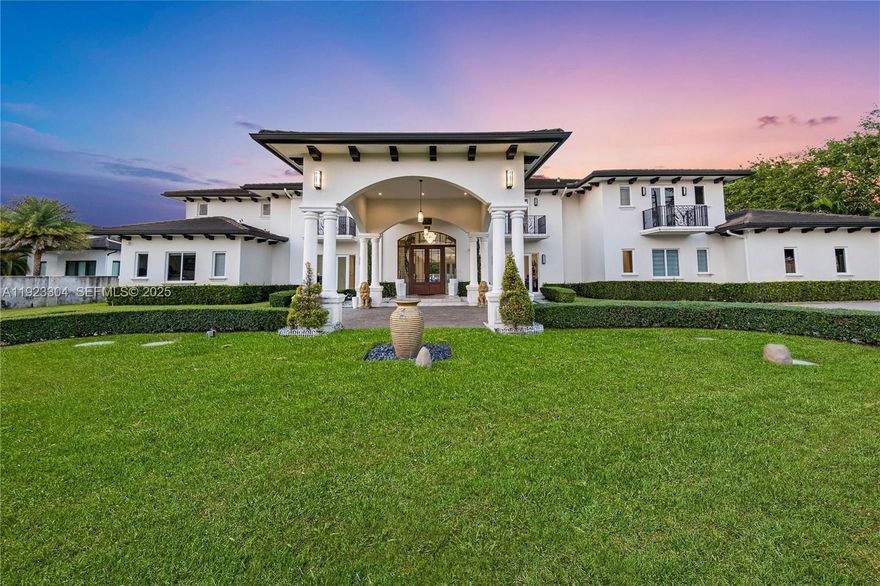 Introducing a rare custom-built architectural masterpiece where nature, sophistication & luxury merge as one. A grand entrance that opens to soaring ceilings w/custom wooden doors, 2 separate staircases, elevator & floor-to-ceiling impact glass. Just under 2 acres in the heart of Horse Country with more than 12,804sf of actual area, this gated sanctuary comes equipped with 8 great sized bedrooms, 11 bathrooms & expansive terraces from each room, giving the feeling of a timeless, tranquil & unmatched legacy estate. Chef’s kitchen boasts an expansive marble island w/stainless steel appliances, multiple midnight bars & an additional outdoor kitchen. Indulge in the ultimate privacy with every fruit tree imaginable; soursop, mango, avocado, lime, oranges, plums, mamey, dragon fruit, passion fruit, cherimoya, plantains, mandarins & more! Both kitchens, family room & outdoor spaces flow together perfectly. The first floor is equipped with 2 bedrooms, 2 offices, kids playroom, study area, theatre room & gym. The second level boasts 6 bedrooms, private family den & an expansive primary suite including dual walk-in closets, spa bath & steam sauna. Enjoy the lush grounds outdoors, an infinity saltwater pool with a swim up bar & jacuzzi, including a waterfall feature. Along with a summer kitchen BBQ area, outdoor spa bedroom & full bathroom. Washers and dryers located on both first & second floors. 3-car garage with ample parking throughout, security system & new concrete flat tile roof.