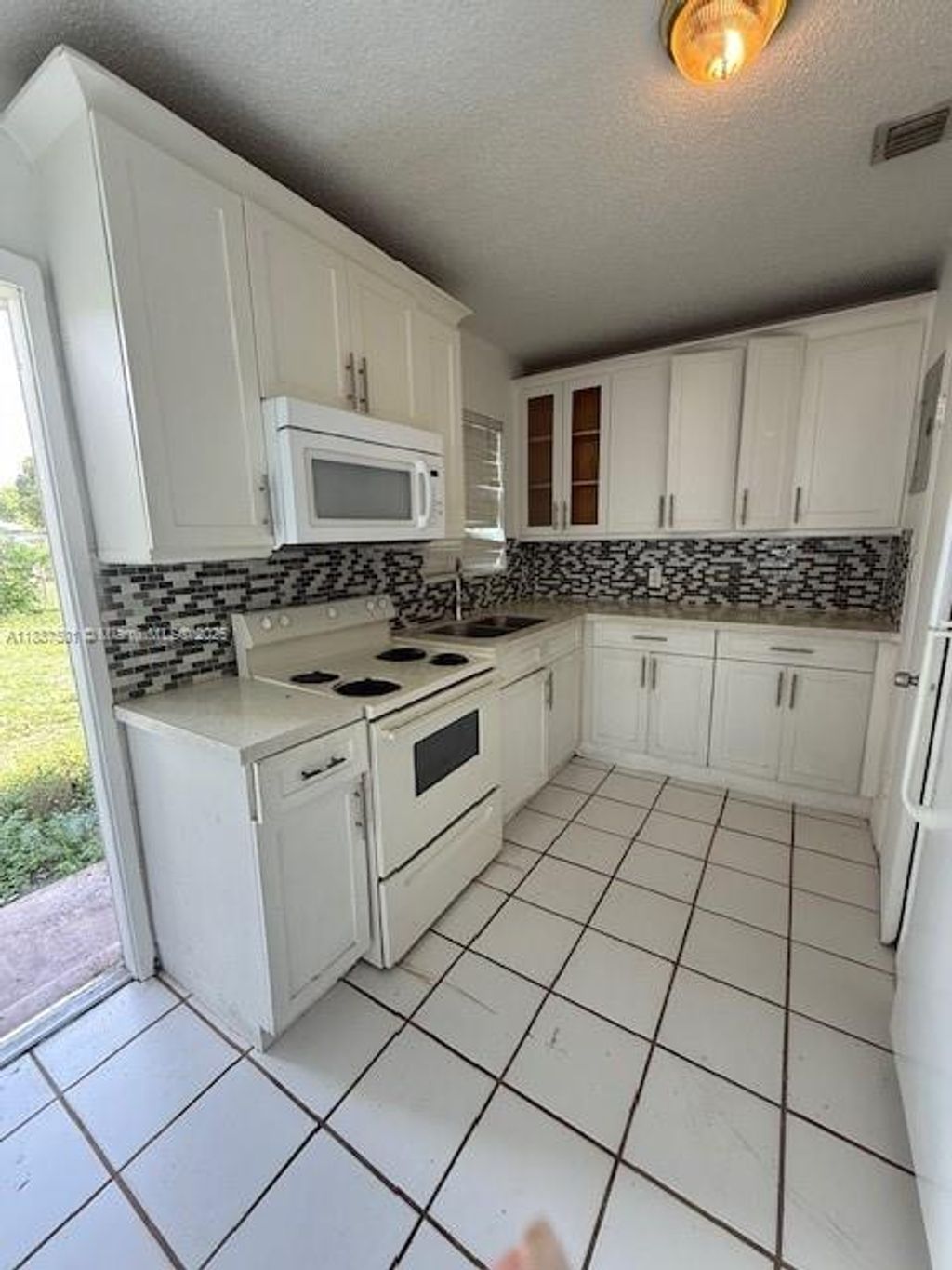 Photo of 1631 NW 14 Ct #1631, Fort Lauderdale, FL 33311 (MLS # A11887501)