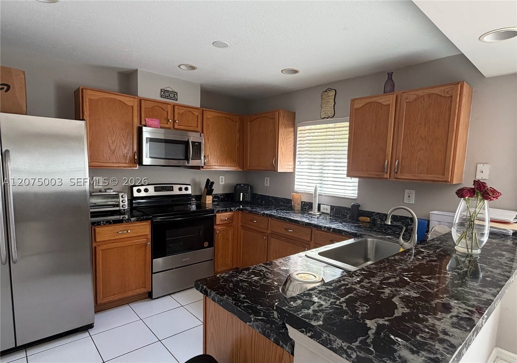 Photo of 2403 SW 106th Ave, Miramar, FL 33025 (MLS # A12075003)