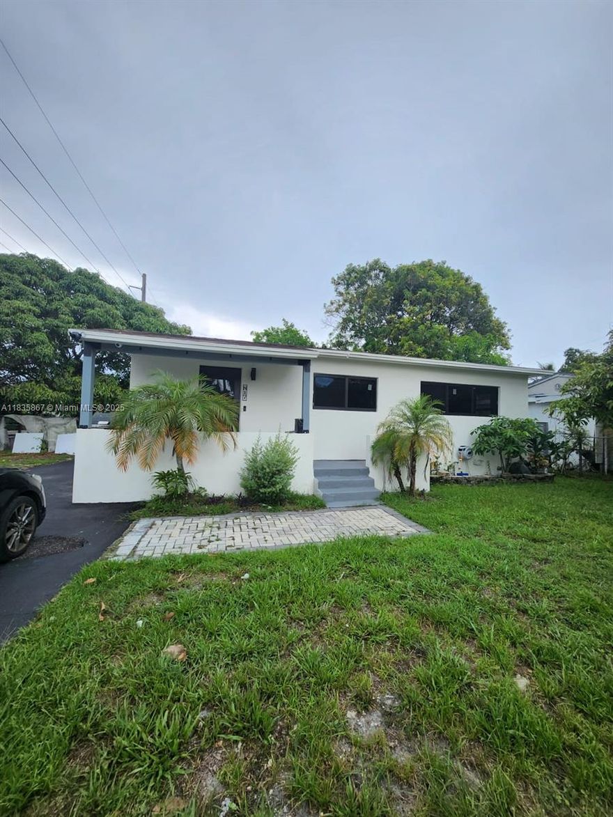 Just reduced! One of a Kind corner smart home, with over 1490 sqft! Completely remodeled with permits: 4 bedrooms, 2 bathrooms, including a master suite with a standing tub and private toilet. The kitchen features a large granite island and countertops. The home has new bathrooms, floors, AC, impact windows, smart appliances, a double wall oven, motion sensors, LED lighting, an AV rack, a control touch panel, and custom closets. All TVs are included in the sale. Exterior highlights include a large outdoor kitchen with a wine cooler, refrigerator, icemaker, sink, and grill, along with a new gazebo and shed. All these features are part of the sale. Mature mango and coconut trees add shade and beauty. Minutes from Wilton Manors, Las Olas Blvd, and the Beach. It must be seen. Call Mari today