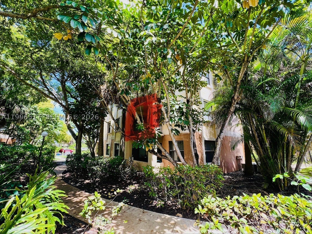 Photo of 9999 Summerbreeze Dr #214, Sunrise, FL 33322 (MLS # A11996517)