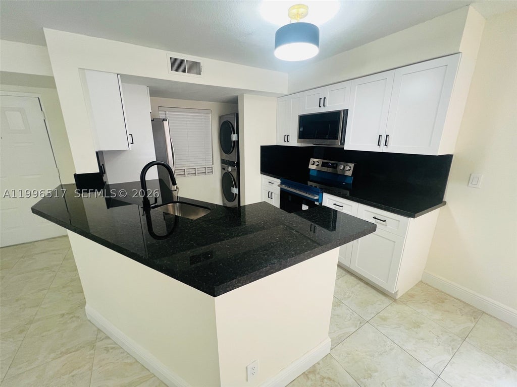 Photo of 9999 Summerbreeze Dr #214, Sunrise, FL 33322 (MLS # A11996517)