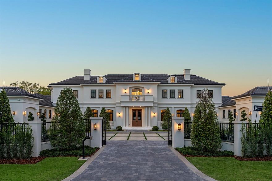 Brand-new Château St. Marie is a timeless French-inspired estate by acclaimed architect Ramon Pacheco, with interiors by Orballo’s Maribel Muniz, ideally set on a prestigious street in the heart of North Pinecrest near top-tier schools. Situated on a 37,897-SF lot with 9,644 SF of refined living space, the home features soaring ceilings, marble floors, bespoke European millwork, dramatic chandeliers, and a stately fireplace. The chef’s kitchen offers premium designer appliances and custom cabinetry. Resort-style grounds include an azure pool with water features, decorative bowls, Jacuzzi, fountains, covered terraces, and a summer kitchen. The residence boasts 7 bedrooms, 8 full baths, 2 half baths, dual primary suites on both levels, guest suite, walk-in wine cellar, home theater, 150 kW full-home residential generator, gated entry, and a 3-car garage with lift capacity.