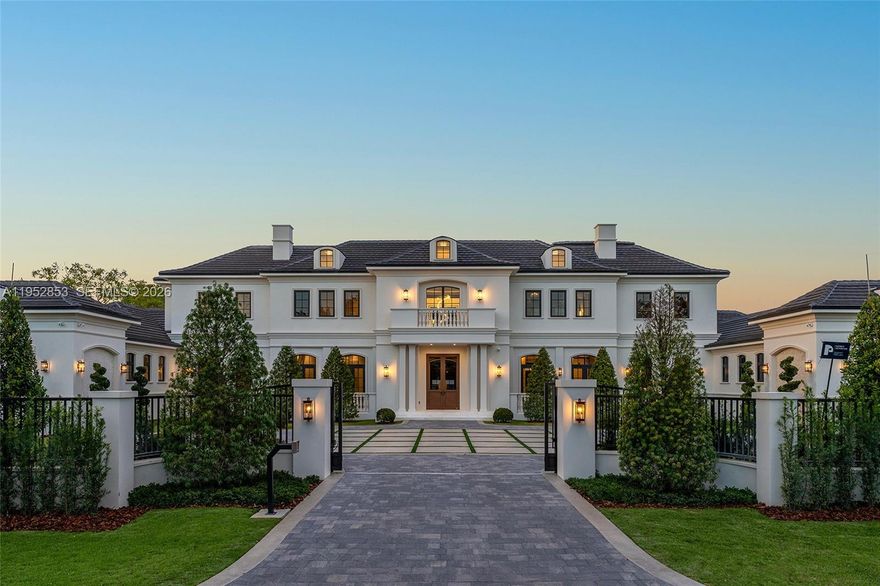 Brand-new Château St. Marie is a timeless French-inspired estate by acclaimed architect Ramon Pacheco, with interiors by Orballo’s Maribel Muniz, ideally set on a prestigious street in the heart of North Pinecrest near top-tier schools. Situated on a 37,897-SF lot with 9,644 SF of refined living space, the home features soaring ceilings, marble floors, bespoke European millwork, dramatic chandeliers, and a stately fireplace. The chef’s kitchen offers premium designer appliances and custom cabinetry. Resort-style grounds include an azure pool with water features, decorative bowls, Jacuzzi, fountains, covered terraces, and a summer kitchen. The residence boasts 7 bedrooms, 8 full baths, 2 half baths, dual primary suites on both levels, guest suite, walk-in wine cellar, home theater, 150 kW full-home residential generator, gated entry, and a 3-car garage with lift capacity.