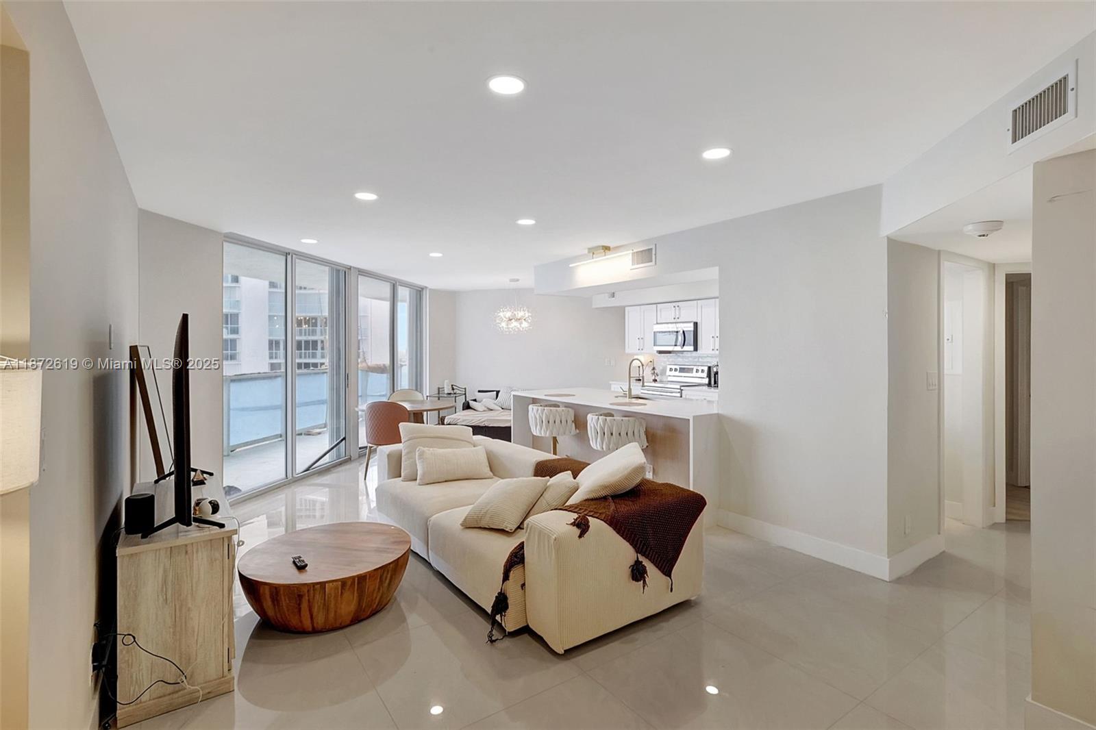 Welcome to Oceania III, Unit 932, in Sunny Isles Beach, FL. This luxurious, fully renovated oceanfront unit offers 2 bedrooms, 2 bathrooms, and 1,260 square feet of living space with direct ocean views and private beach access. The home features a spacious master bedroom, an enclosed den for a second bedroom or office, and a renovated kitchen with stainless steel appliances. Amenities include a doorman, concierge, gym, basketball court, tennis court, and more. Parking is a breeze with a garage, assigned parking, guest parking, and complementary valet service. Experience the ultimate beachfront lifestyle with access to a beach club and a vibrant community. Offered either Furnished or Unfurnished.