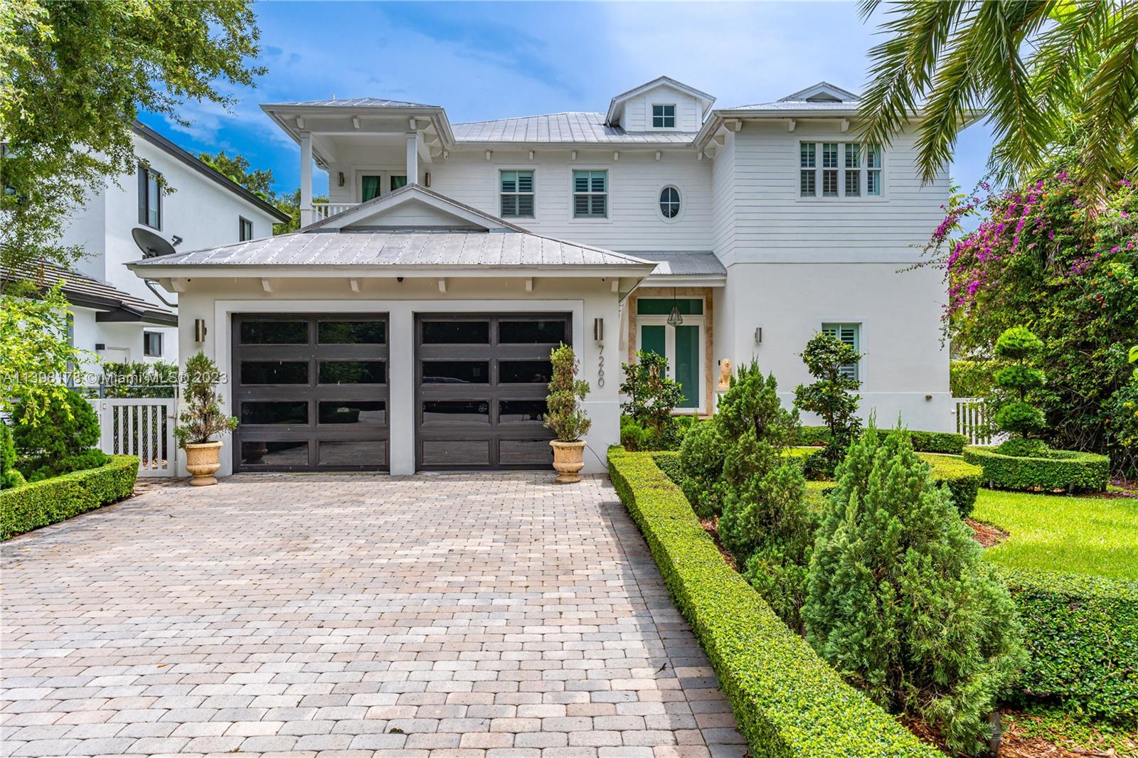 Gorgeous two story home in highly desirable city of Palmetto Bay. Walk in to an elegant home with soaring ceilings featuring one bedroom and bath on the first floor. Open concept kitchen with stainless steel appliances and plenty of cabinets, family room and breakfast area over look the serene pool and beautiful landscape. Impeccable porcelain floors throughout the home, the modern stairs with glass railings lead to 2nd floor sitting area. Huge Master bedroom with 2 walk in closets, master bath features hot tub, walk in shower & his/her sink. 2 bedrooms with ensuite baths. Picture perfect pool with covered patio, beautiful travertine and fenced yard. Impact windows and doors through out the home, laundry room, plantation shutters and a 2 car​​‌​​​​‌​‌​​​‌‌​​​‌‌‌​​‌​​‌‌​​​​ garage.