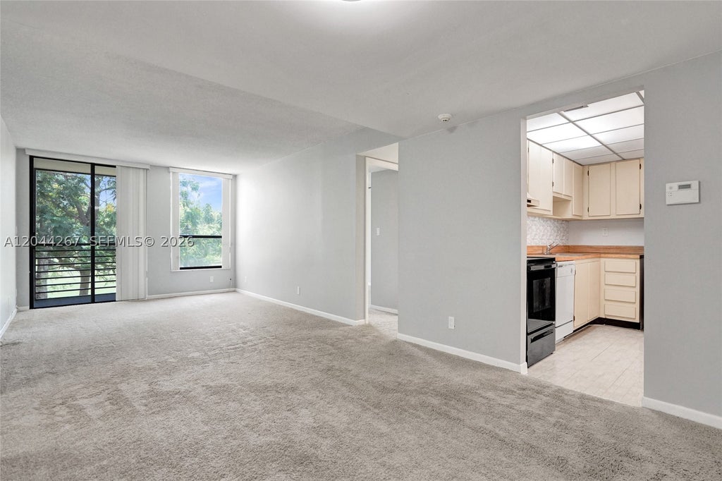 Photo of 7850 W Mcnab Rd #210, Tamarac, FL 33321 (MLS # A12044267)