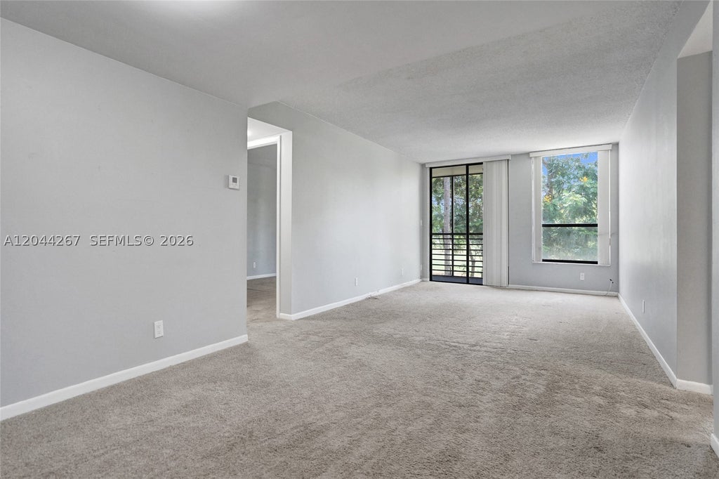 Photo of 7850 W Mcnab Rd #210, Tamarac, FL 33321 (MLS # A12044267)